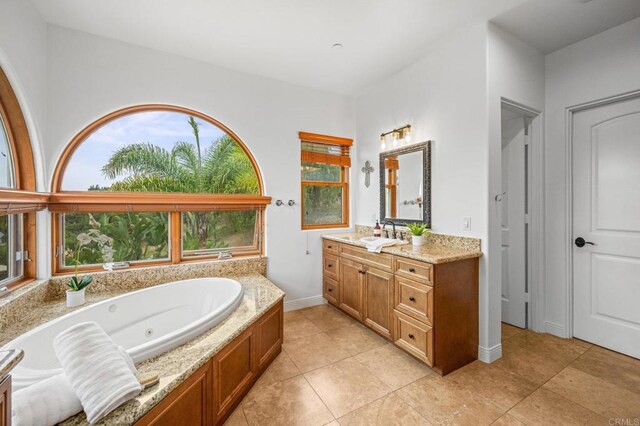 4149 Manchester Ave, Encinitas, CA 92024 - full bathroom featuring vanity, a whirlpool tub, and tile patterned floors