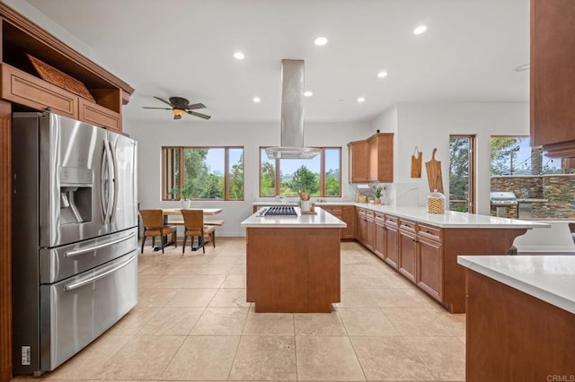 4149 Manchester Ave, Encinitas, CA 92024 - kitchen with stainless steel appliances, a peninsula, island exhaust hood, light countertops, and recessed lighting