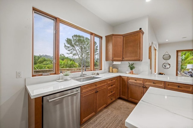4149 Manchester Ave, Encinitas, CA 92024 - kitchen with stainless steel dishwasher, brown cabinetry, recessed lighting, light stone counters, and light tile patterned floors
