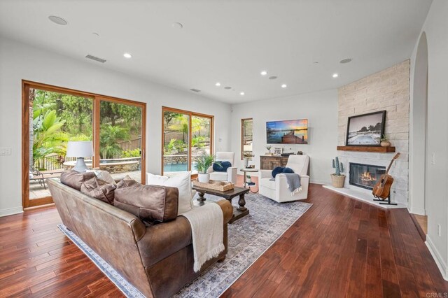 4149 Manchester Ave, Encinitas, CA 92024 - living area with a fireplace, dark wood finished floors, and recessed lighting
