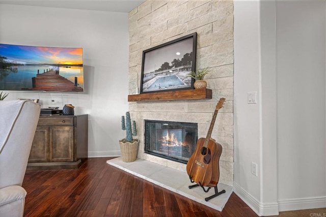 4149 Manchester Ave, Encinitas, CA 92024 - living room featuring wood finished floors and a stone fireplace