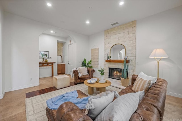 4149 Manchester Ave, Encinitas, CA 92024 - living room with arched walkways, recessed lighting, and a fireplace