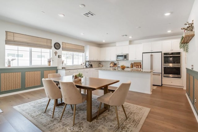 874 Royal Knight Trl, Redlands, CA 92374 - dining space featuring wood finished floors and recessed lighting