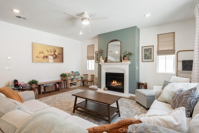874 Royal Knight Trl, Redlands, CA 92374 - living area with a glass covered fireplace, plenty of natural light, ceiling fan, wood finished floors, and recessed lighting