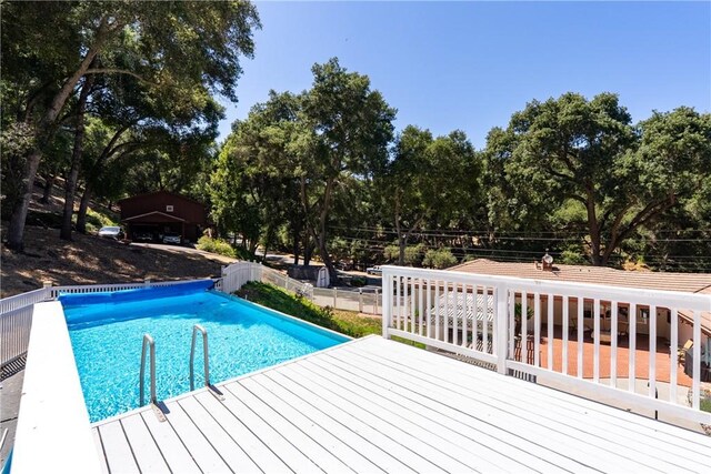 7735 Del Rio Rd, Atascadero, CA 93422 - view of pool with a deck and view of wooded area