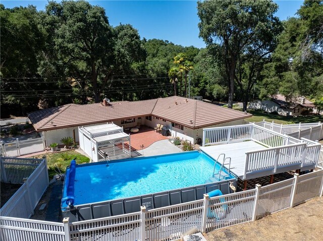 7735 Del Rio Rd, Atascadero, CA 93422 - view of swimming pool with a fenced backyard and a wooden deck