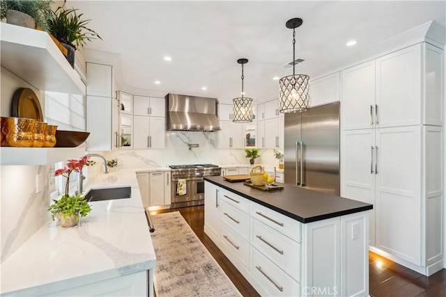2937 Arboridge Ct, Fullerton, CA 92835 - kitchen featuring wall chimney range hood, high end appliances, dark wood finished floors, white cabinets, and a kitchen island