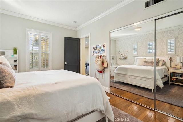 2937 Arboridge Ct, Fullerton, CA 92835 - bedroom featuring crown molding, wood-type flooring, and a closet