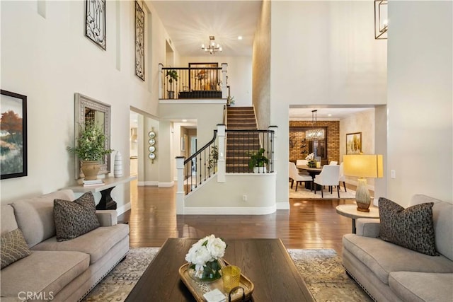 2937 Arboridge Ct, Fullerton, CA 92835 - living room featuring a chandelier, stairs, wood finished floors, and a high ceiling