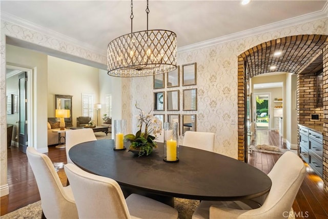 2937 Arboridge Ct, Fullerton, CA 92835 - dining space with hardwood / wood-style flooring, a chandelier, ornamental molding, and arched walkways