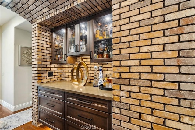 2937 Arboridge Ct, Fullerton, CA 92835 - indoor bar featuring decorative backsplash, dark wood-style flooring, and arched walkways