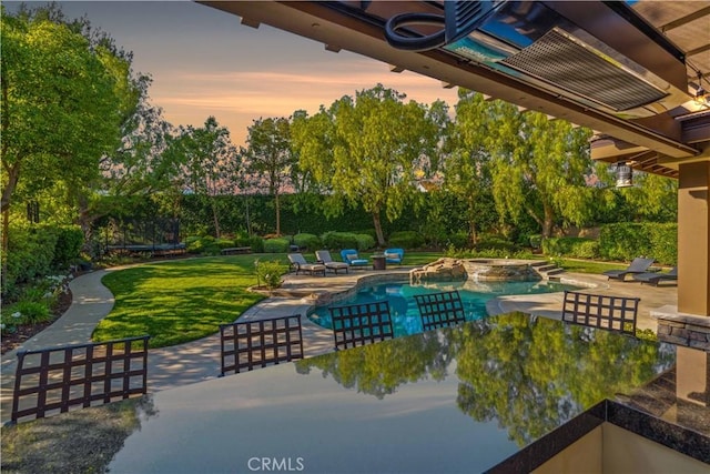 2937 Arboridge Ct, Fullerton, CA 92835 - swimming pool with a patio, a trampoline, a lawn, an in-ground hot tub, and view of wooded area