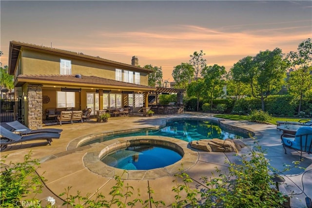 2937 Arboridge Ct, Fullerton, CA 92835 - pool at dusk with an outdoor living space, a patio area, a pool with connected hot tub, and a pergola