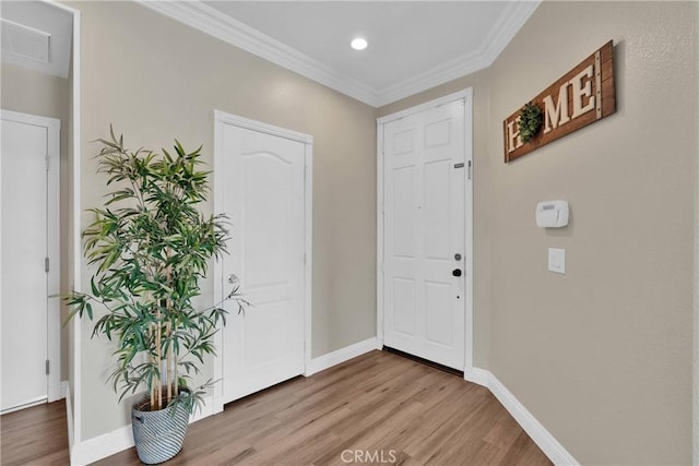 16315 Yorba Linda Ln, Fontana, CA 92336 - foyer featuring wood finished floors, crown molding, and recessed lighting