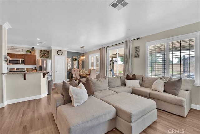 16315 Yorba Linda Ln, Fontana, CA 92336 - living area featuring light wood-style floors and ornamental molding