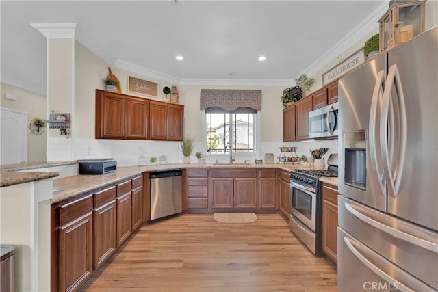 16315 Yorba Linda Ln, Fontana, CA 92336 - kitchen featuring stainless steel appliances, light wood finished floors, recessed lighting, light stone countertops, and crown molding