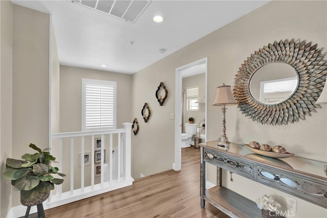 16315 Yorba Linda Ln, Fontana, CA 92336 - hallway with wood finished floors, healthy amount of natural light, and recessed lighting