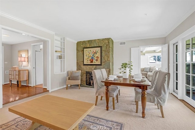 252 W 15th St, Upland, CA 91786 - dining area featuring crown molding, light carpet, and built in features
