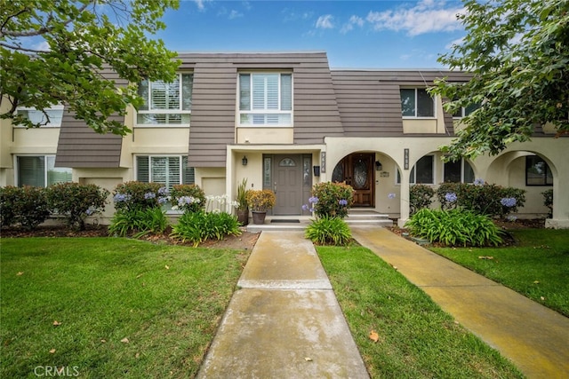 9676 Bloomfield St, Cypress, CA 90630 - view of property with stucco siding and a front lawn