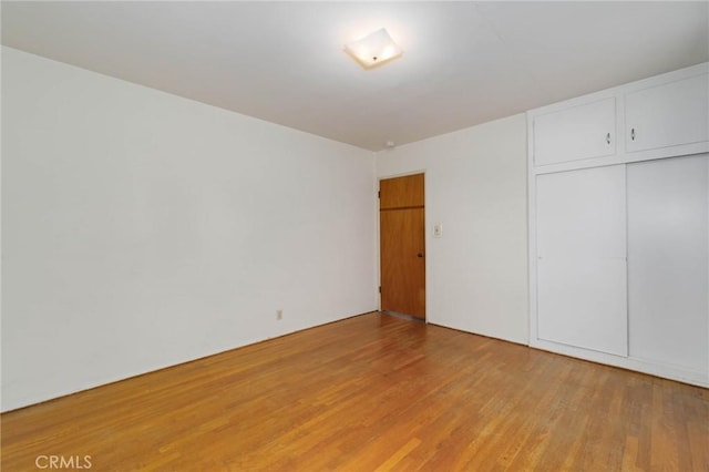 11701 Roseglen St, El Monte, CA 91732 - unfurnished bedroom featuring light wood-style flooring and a closet