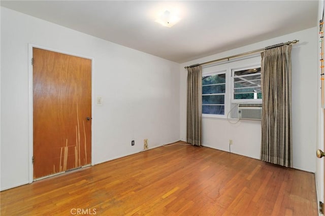11701 Roseglen St, El Monte, CA 91732 - unfurnished room with wood finished floors and cooling unit