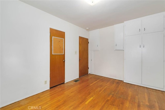 11701 Roseglen St, El Monte, CA 91732 - unfurnished bedroom featuring light wood-type flooring