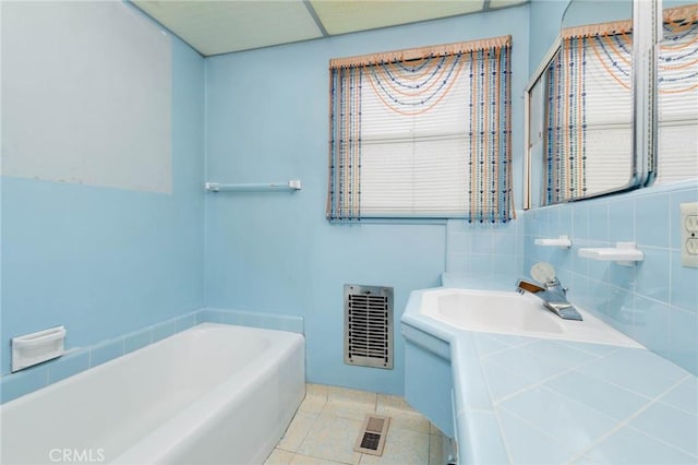 11701 Roseglen St, El Monte, CA 91732 - full bathroom featuring a garden tub, vanity, tile patterned floors, and tasteful backsplash