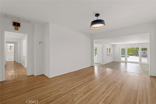 9508 Jellico Ave, Northridge, CA 91325 - unfurnished living room featuring light wood finished floors and baseboards
