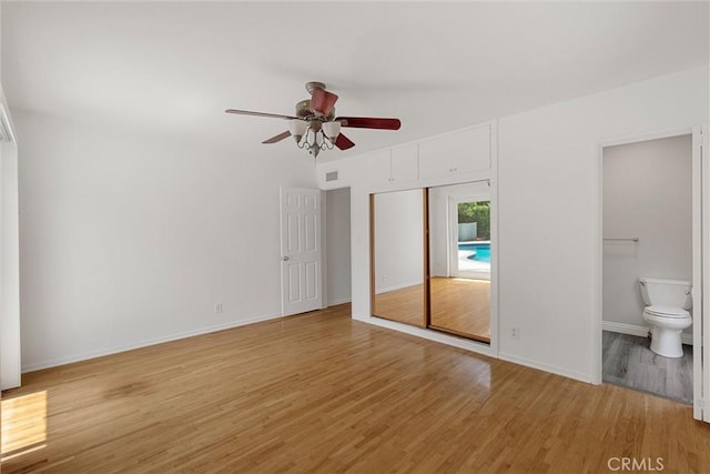 9508 Jellico Ave, Northridge, CA 91325 - unfurnished bedroom with light wood finished floors, connected bathroom, a closet, and ceiling fan