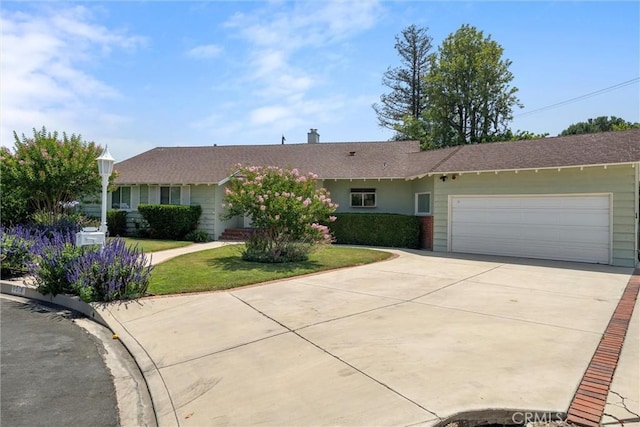 9508 Jellico Ave, Northridge, CA 91325 - ranch-style house with a garage, driveway, a front lawn, and a chimney