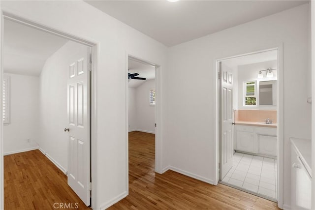 9508 Jellico Ave, Northridge, CA 91325 - hallway featuring light wood-type flooring and healthy amount of natural light
