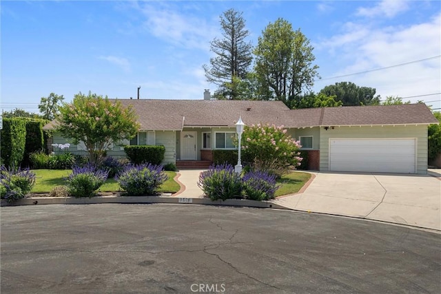 9508 Jellico Ave, Northridge, CA 91325 - single story home with a garage, concrete driveway, and a chimney