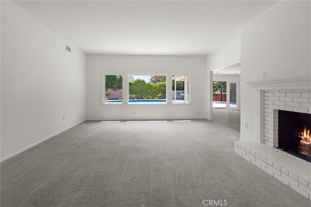 9508 Jellico Ave, Northridge, CA 91325 - unfurnished living room with carpet floors and a brick fireplace