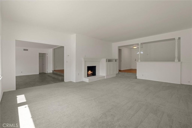 9508 Jellico Ave, Northridge, CA 91325 - unfurnished living room with carpet flooring and a brick fireplace
