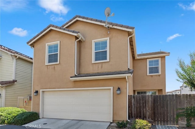 5529 N Valdez, Fresno, CA 93722 - view of front facade with stucco siding, a garage, and concrete driveway