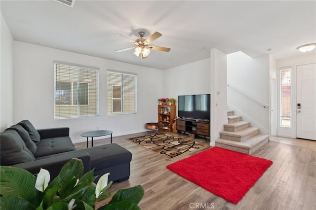 5529 N Valdez, Fresno, CA 93722 - living room featuring stairs, wood finished floors, and a ceiling fan