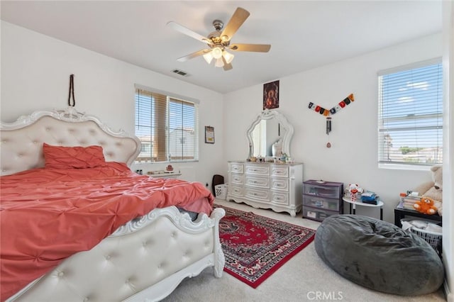 5529 N Valdez, Fresno, CA 93722 - bedroom with carpet flooring, multiple windows, and a ceiling fan