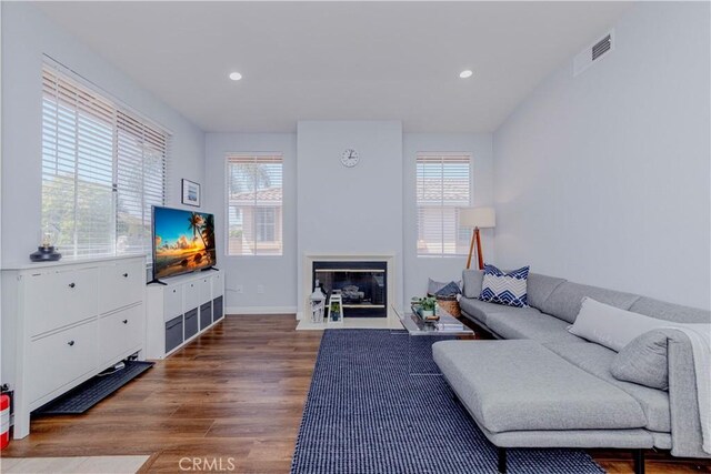500 Tropea Aisle, Irvine, CA 92606 - living room featuring wood finished floors, a fireplace with flush hearth, and recessed lighting