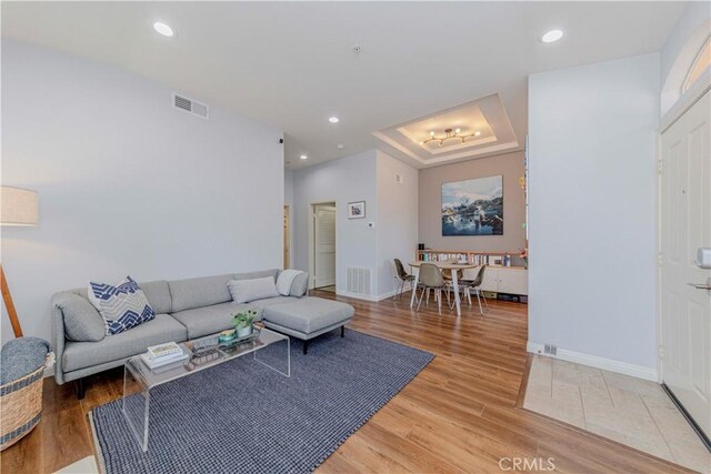 500 Tropea Aisle, Irvine, CA 92606 - living area featuring light wood-type flooring, recessed lighting, and a tray ceiling