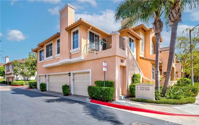 500 Tropea Aisle, Irvine, CA 92606 - view of building exterior with an attached garage