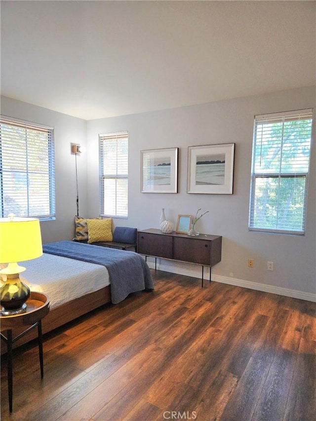 500 Tropea Aisle, Irvine, CA 92606 - bedroom with dark wood-style floors and multiple windows