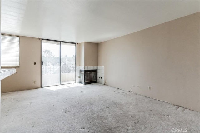 28006 S Western Ave Unit 267, San Pedro, CA 90732 - unfurnished living room with a fireplace and carpet
