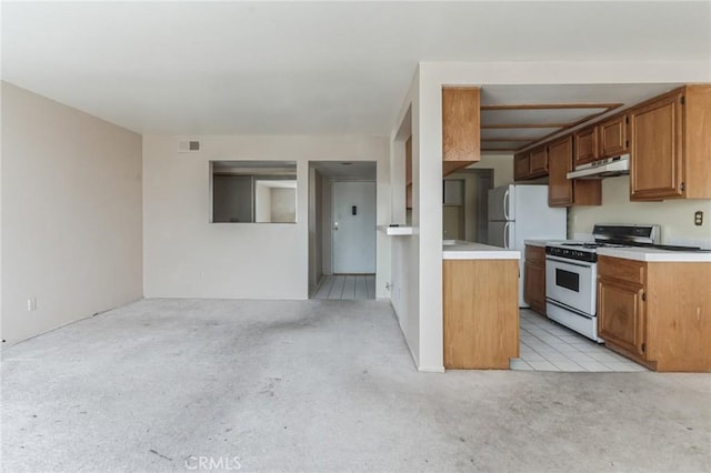 28006 S Western Ave Unit 267, San Pedro, CA 90732 - kitchen with white appliances, light colored carpet, under cabinet range hood, and light countertops