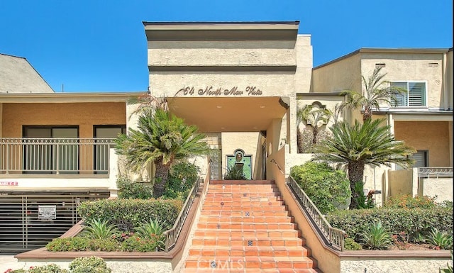 64 N Mar Vista Ave Unit 231, Pasadena, CA 91106 - view of front facade featuring stairway and stucco siding