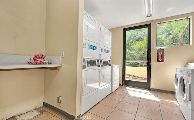 64 N Mar Vista Ave Unit 231, Pasadena, CA 91106 - shared laundry room featuring independent washer and dryer, light tile patterned flooring, and stacked washing machine and dryer