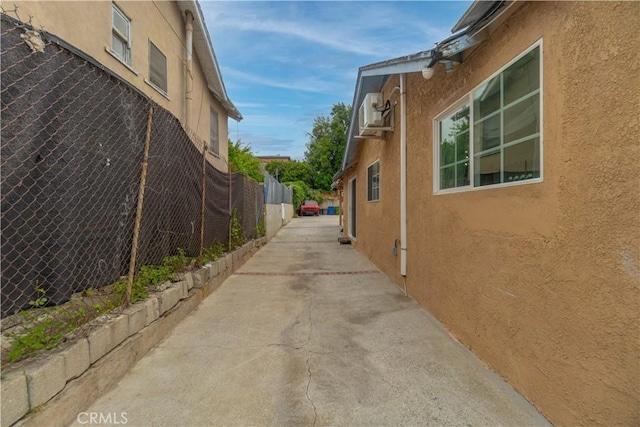 3219 E 6th St, Los Angeles, CA 90023 - view of side of property with stucco siding and a patio area