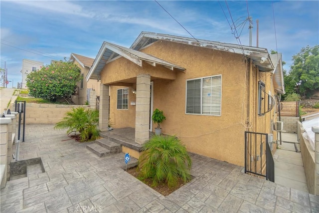 3219 E 6th St, Los Angeles, CA 90023 - view of home's exterior with stucco siding and a patio area