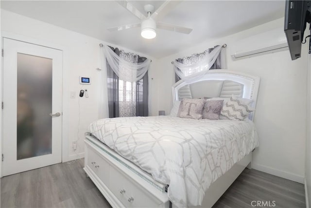 3219 E 6th St, Los Angeles, CA 90023 - bedroom with wood finished floors, multiple windows, and ceiling fan