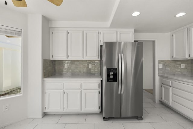 4958 Alicante Way, Oceanside, CA 92056 - kitchen featuring stainless steel refrigerator with ice dispenser, light countertops, white cabinets, and recessed lighting