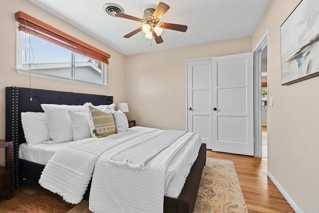 3833 Tomahawk Ln, San Diego, CA 92117 - bedroom with wood finished floors and a ceiling fan
